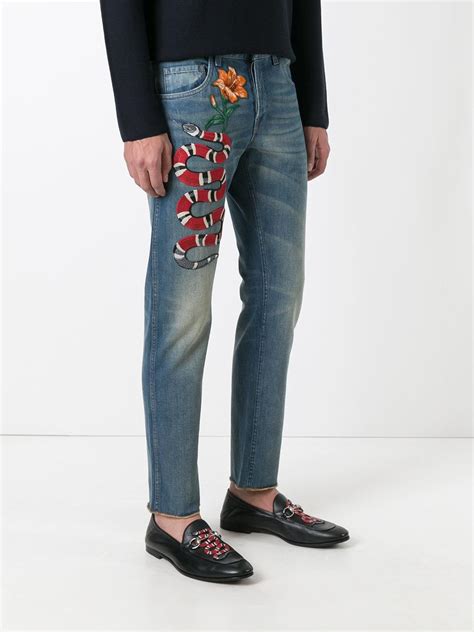 gucci embroidered jeans.